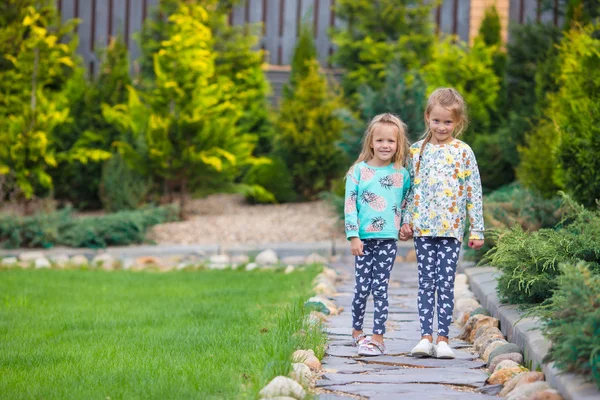 Little adorable girls at warm sunny autumn day outdoors — Stock Photo, Image