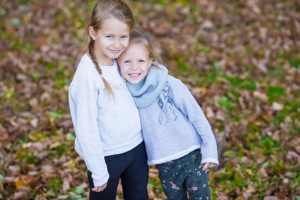 Little adorable girls outdoors at warm sunny autumn day — Stock Photo, Image