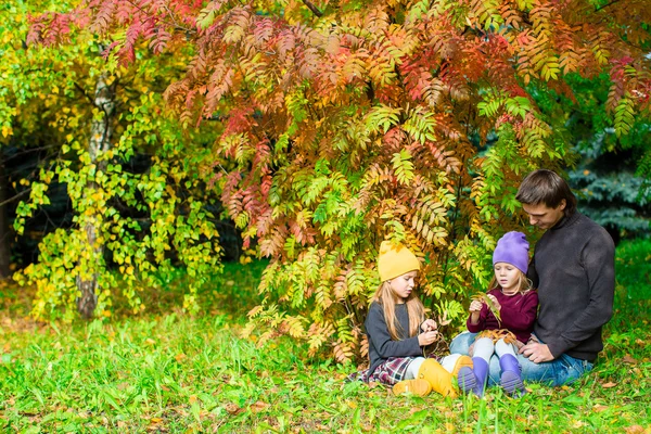 Happy family in autumn park outdoors — Stock Photo, Image