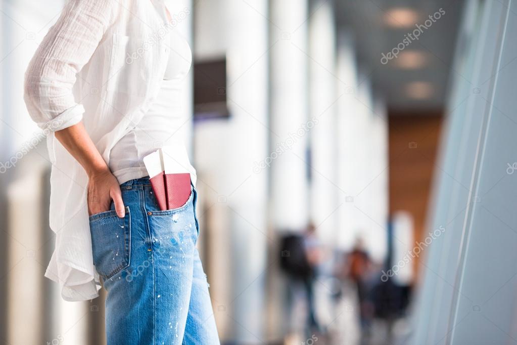 Closeup passports and boarding pass at airport indoor background airplane