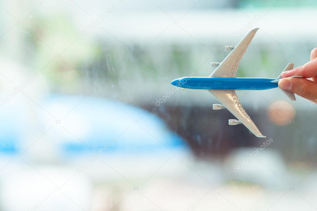 Closeup small miniature airplane at airport indoor