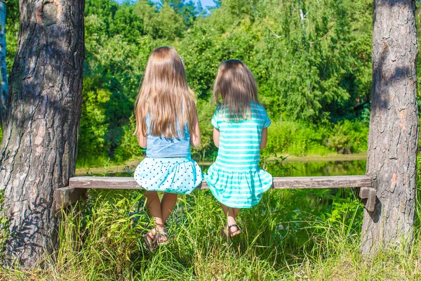 Little adorable girls outdoors at summer time — Stock Photo, Image