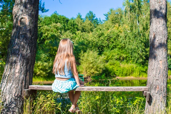 Happy adorable little girl enjoy summer day outdoors — Stock Photo, Image