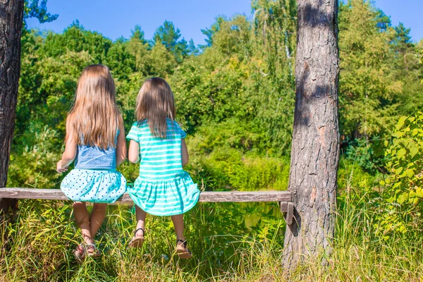 Little adorable girls outdoors at summer time — Stock Photo, Image