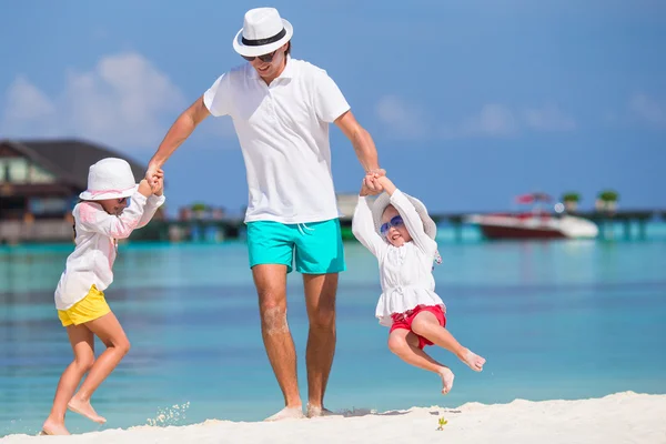 Happy beautiful family on a tropical beach vacation — Stock Photo, Image