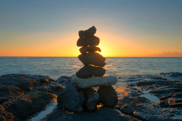 Rock stack on the beach at sunset. Big Island,  Hawaii