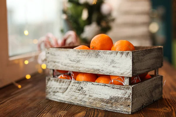 Christmas decoration. Christmas cooking. Dough, flour, cookies, tangerines, cup, mug, christmas ligths. box with fruit, opels on the windowsill old vintage — Stock Photo, Image