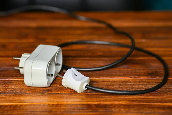 Cables and extension blocks, electreic devices in a mess — Stock Photo, Image