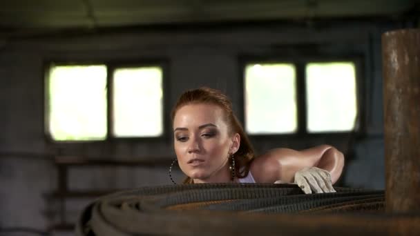 Sexy girl and a high-voltage cable — Stock Video