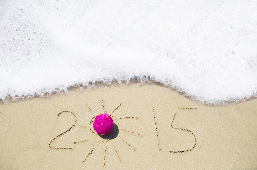 Number 2015 on the sand - holiday concept