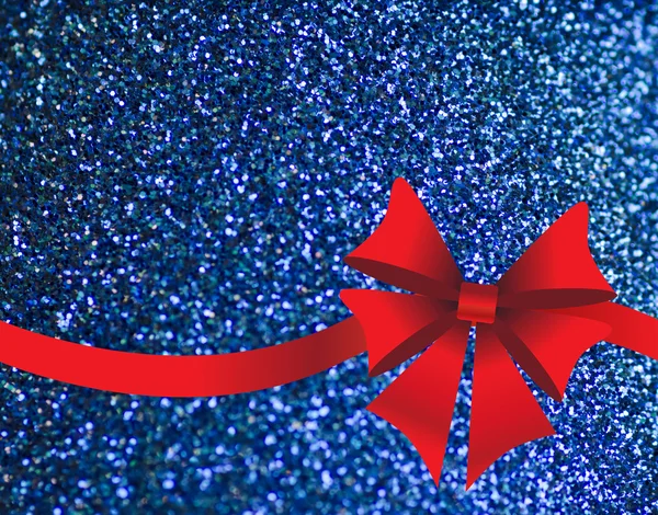 Sparkling blue background with red bow — Stock Photo, Image