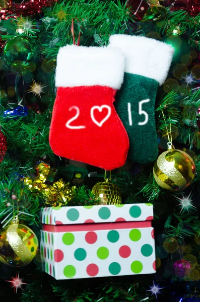 Christmas socks on the tree — Stock Photo, Image