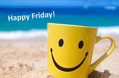 Happy face mug on the beach
