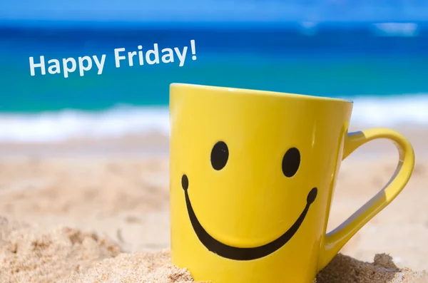 Happy face mug on the beach