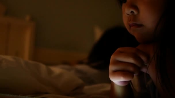 Cute Little Girl Watching Video Digital Tablet Night Reflected Light — Stock Video
