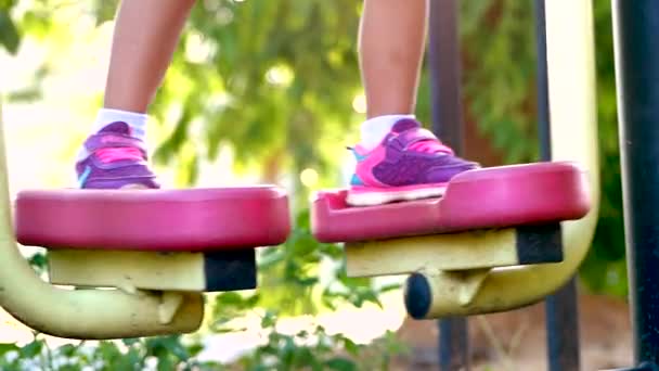 Close Legs Little Child Sports Sneakers Stands Outdoor Fitness Equipment — Stock Video