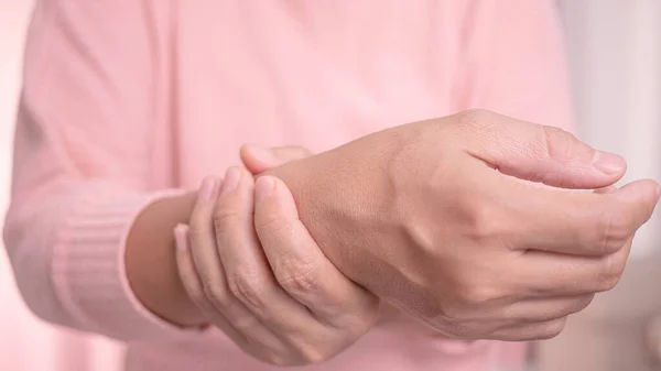 Closeup Female Holding Her Painful Wrist Caused Prolonged Work Computer — Stock Photo, Image