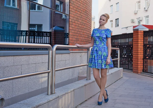 Young girl blonde in blue short dress — Stock Photo, Image