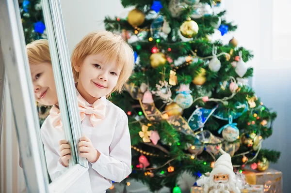 Happy boy near christmas tree — Stock Photo, Image