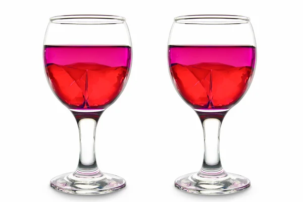 Two glasses with a pink cocktail and precious stones on a white background — Stock Photo, Image