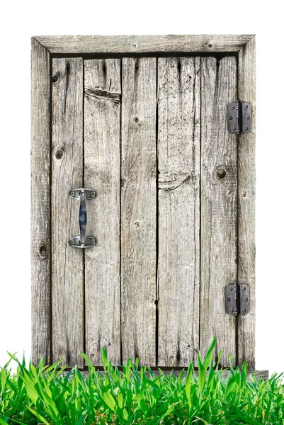 白い背景に芝生が隔離された木製のドア. — ストック写真
