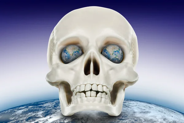 Mänsklig skalle på en bakgrund av planetjorden. — Stockfoto