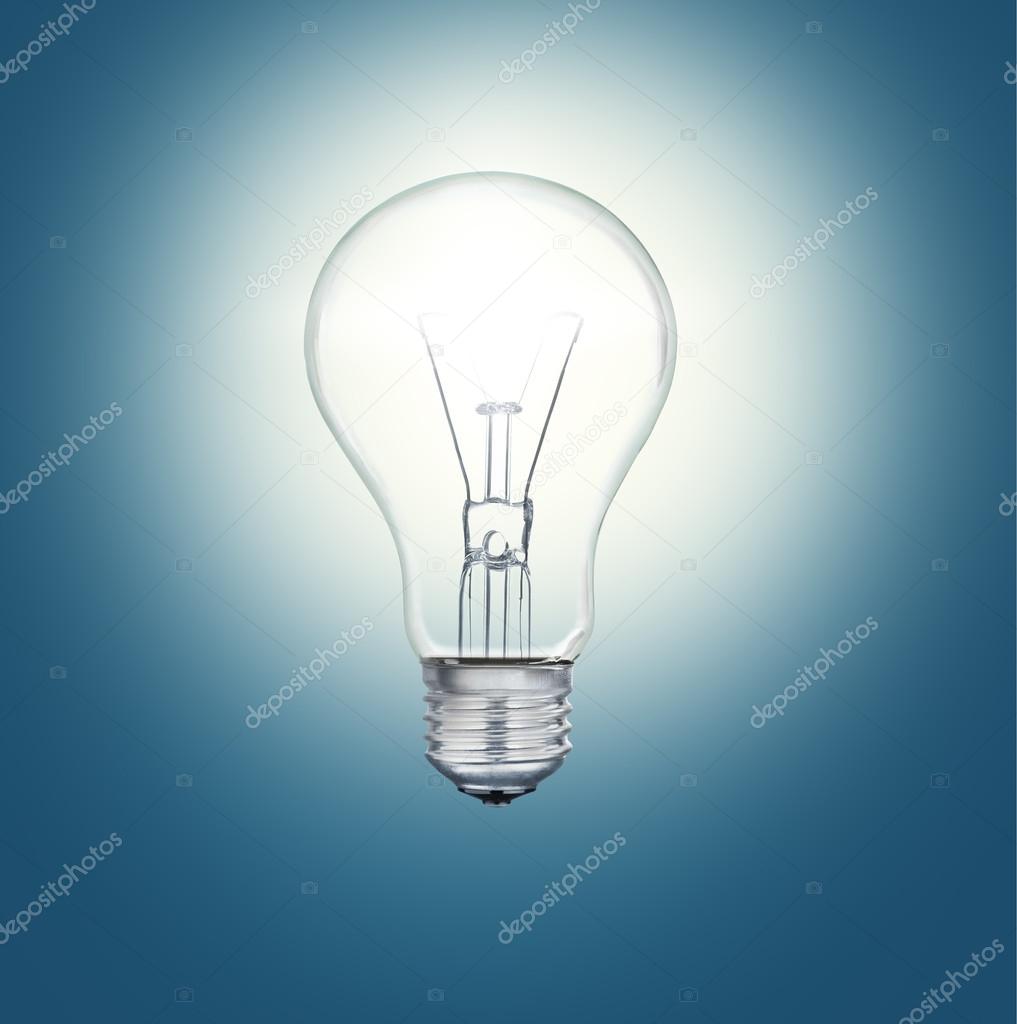 A light bulb shines in the darkness bright light