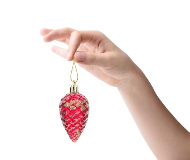 Female hand holding a Christmas toy isolated on white background
