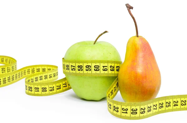 Apple and pear wrapped measuring tape on white background — 图库照片