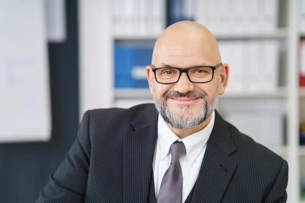 Friendly businessman with a goatee and glasses — Stock Photo, Image