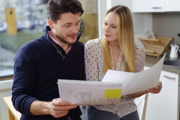 Young couple planning for a new home — Stock Photo, Image