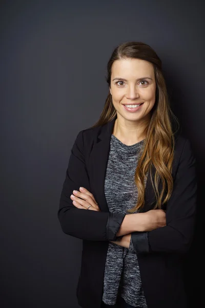 Smiling friendly young woman with long hair — Stock Photo, Image