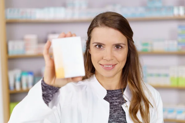 Pharmacist showing box of medicine — Stock Photo, Image
