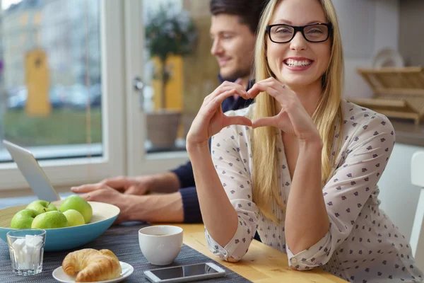 Woman in love with man on laptop — Stock Photo, Image