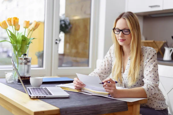 Woman with eyeglasses paying bills — 스톡 사진