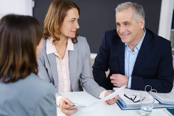 Smiling friendly businessman in a meeting — Stock Photo, Image