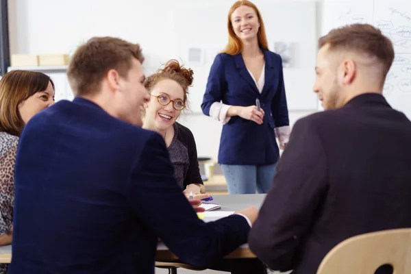 Animated young woman in a business meeting — Stock Photo, Image