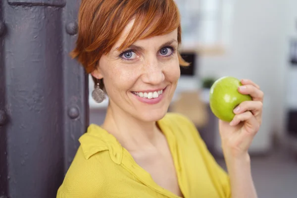 Pretty young red haired woman in yellow blouse — Stock Photo, Image