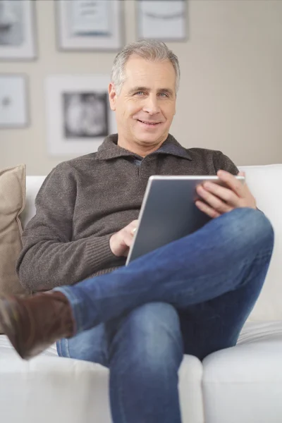 Attractive middle-aged man relaxing at home — Stock Photo, Image