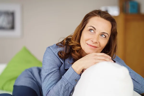 Attractive housewife sitting daydreaming — Stock Photo, Image