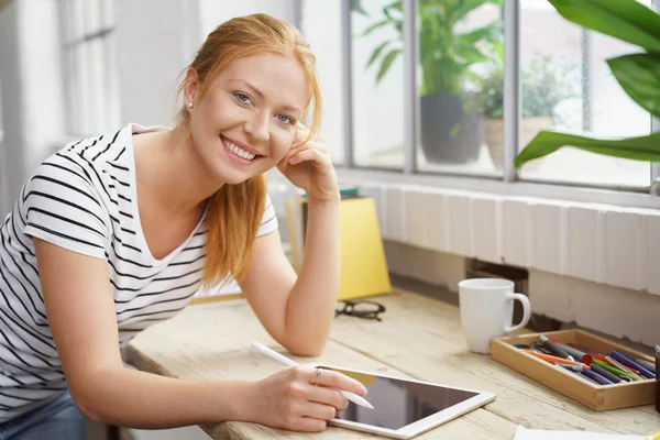 Creative college student smiles while working — Stock Photo, Image