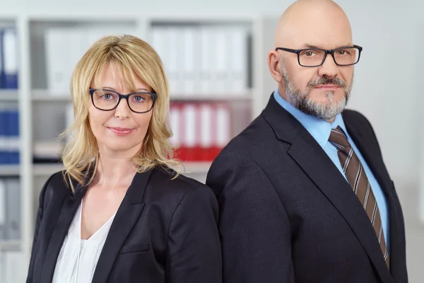 Two serious business people in suit jackets — Stock Photo, Image