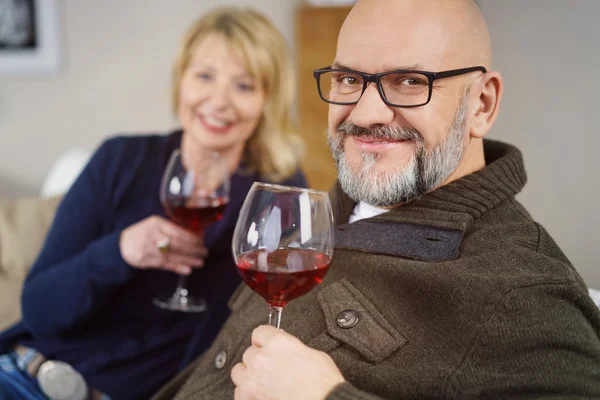 Friendly middle-aged man enjoying a glass of wine — Stock Photo, Image