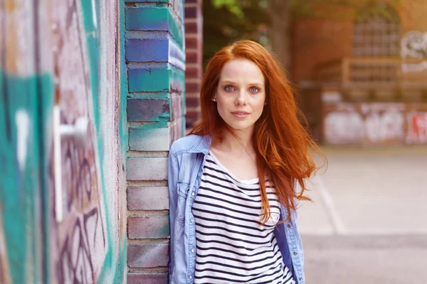 Pretty casual young redhead woman outdoors — Stock Photo, Image