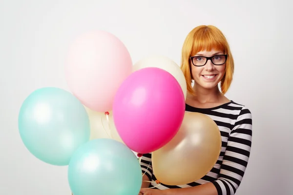 Smiling happy woman holding festive party balloons — Stock Photo, Image