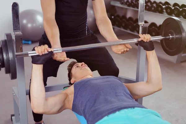 Fit male bodybuilder lifting weights — Stock Photo, Image