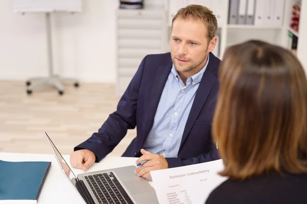 Earnest young man in a business meeting — Stock Photo, Image