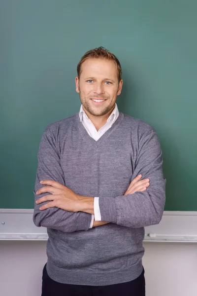 Confident friendly young male teacher — Stock Photo, Image