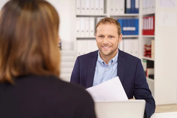 Happy friendly young businessman in a meeting — Stock Photo, Image