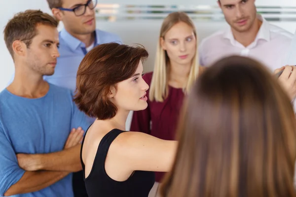 Female team leader brainstorming with colleagues — Stock Photo, Image